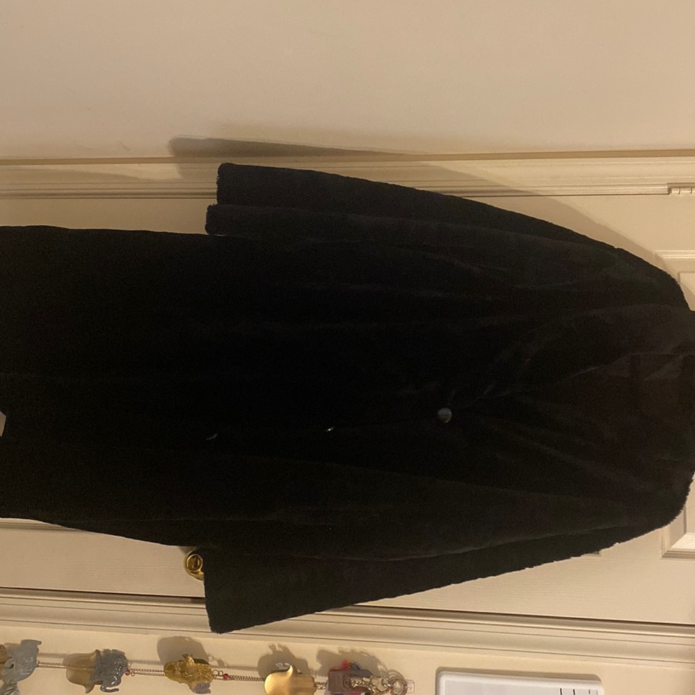 Reversible, faux fur, shawl collar coat with pockets.